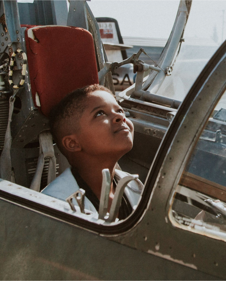 Child In Plane Cockpit Feature